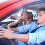 man and woman scared in the car